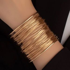 Gold cud’s bracelet.